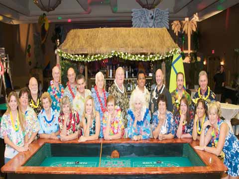 casino party dealser in hawaiian dress